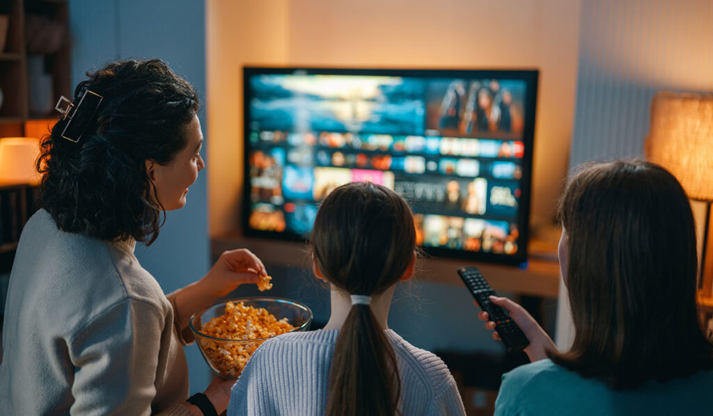 family watching on a streaming platform on tv